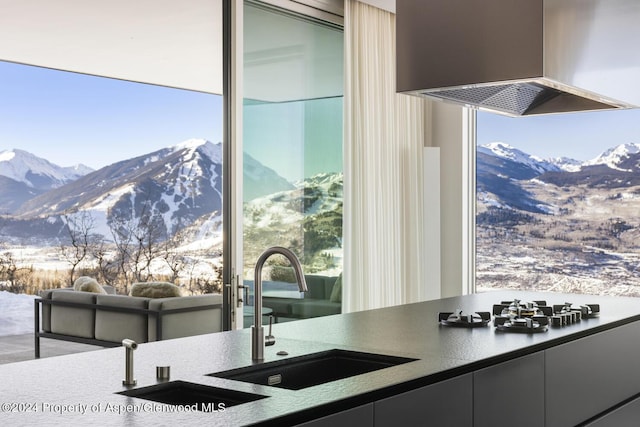 542 Carroll Dr, Aspen, CO 81611 - kitchen featuring wall chimney exhaust hood, a mountain view, and a sink