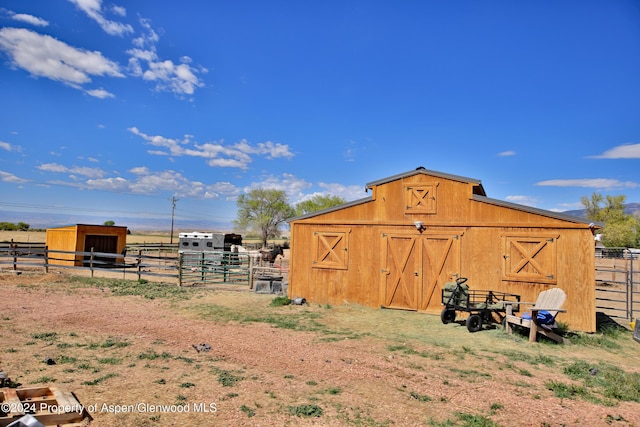 view of outbuilding featuring a rural view