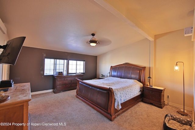 carpeted bedroom with vaulted ceiling with beams and ceiling fan