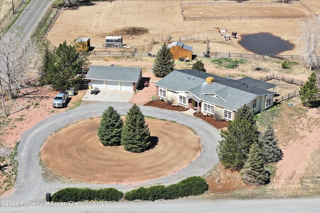 birds eye view of property featuring a rural view