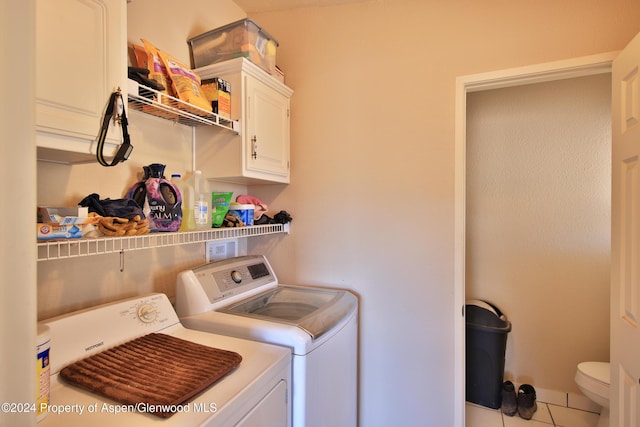 clothes washing area with tile patterned floors and independent washer and dryer