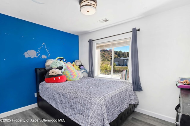 2086 Acacia Ave, Rifle, CO 81650 - bedroom featuring wood finished floors and baseboards