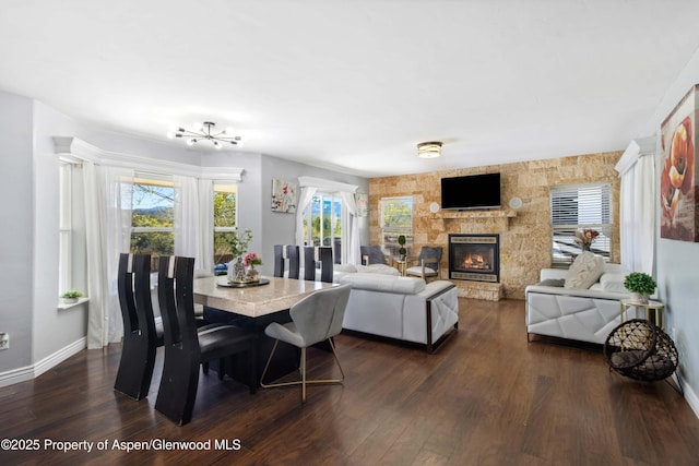 2086 Acacia Ave, Rifle, CO 81650 - dining space featuring dark wood-style floors and a fireplace