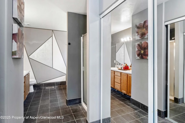 2086 Acacia Ave, Rifle, CO 81650 - bathroom with vanity, tile patterned flooring, and a shower