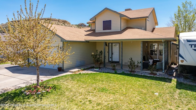 2086 Acacia Ave, Rifle, CO 81650 - view of front of house featuring covered porch, a front yard, driveway, roof with shingles, and an attached garage