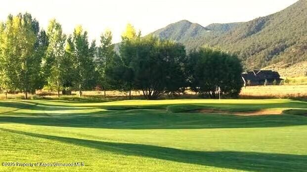 589 Saddleback Rd, Carbondale, CO 81623 - view of home's community with a mountain view, golf course view, and a yard