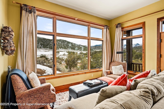 sunroom / solarium with a mountain view