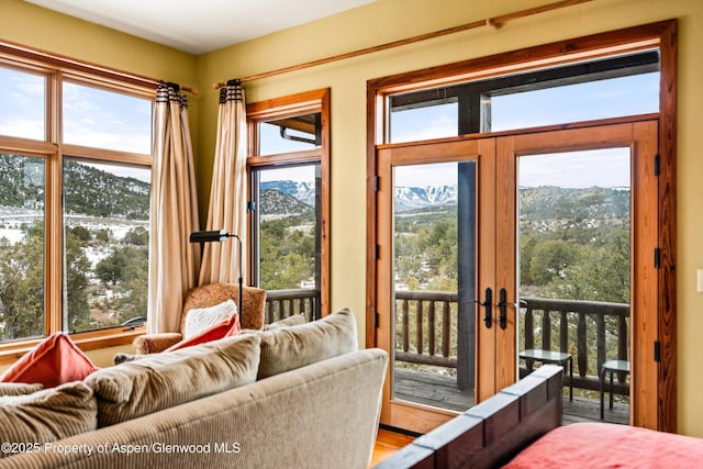 doorway to outside with french doors and a mountain view