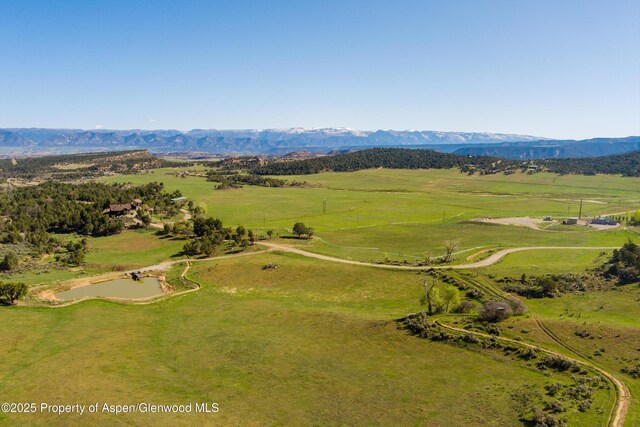 857 Indian Rock Rd, Silt, CO 81652 - view of side of property with stone siding and a mountain view