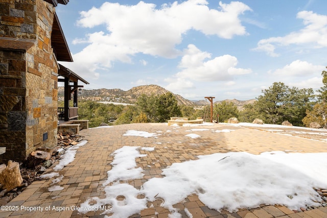 view of yard with a mountain view and a patio