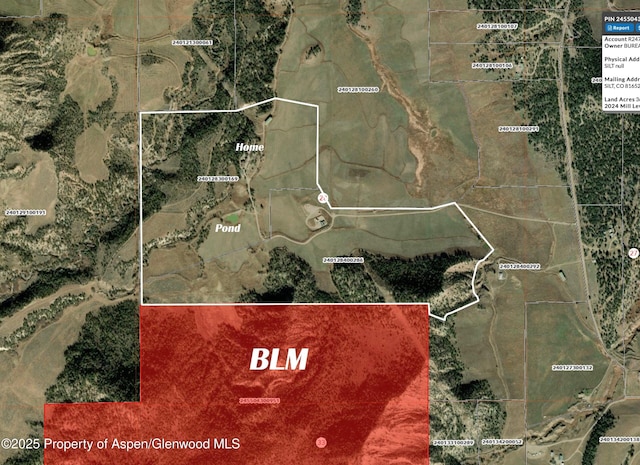 857 Indian Rock Rd, Silt, CO 81652 - back of house with a patio area, a balcony, a mountain view, and a chimney
