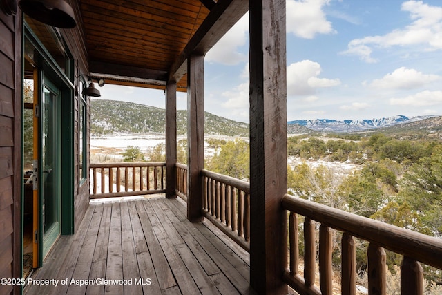 wooden terrace featuring a mountain view