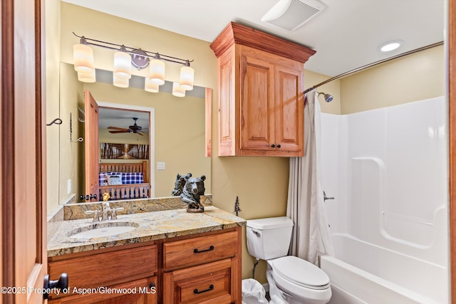 full bathroom featuring ceiling fan, shower / tub combo with curtain, vanity, and toilet