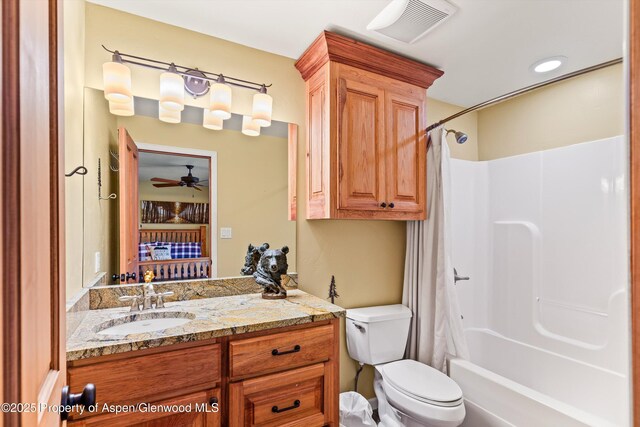 full bath with visible vents, toilet, ceiling fan, shower / bath combination with curtain, and vanity