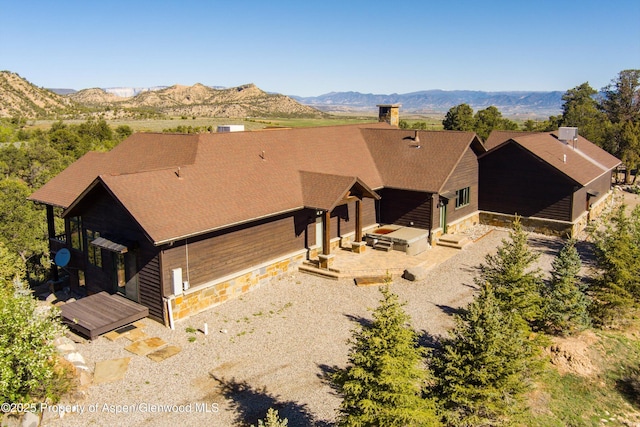 857 Indian Rock Rd, Silt, CO 81652 - dining space with a chandelier, wood walls, lofted ceiling, and wood finished floors