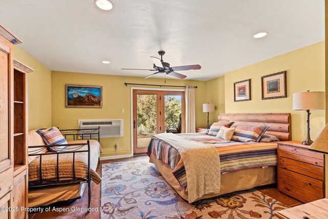 bedroom featuring access to exterior, recessed lighting, a wall mounted AC, a ceiling fan, and wood finished floors