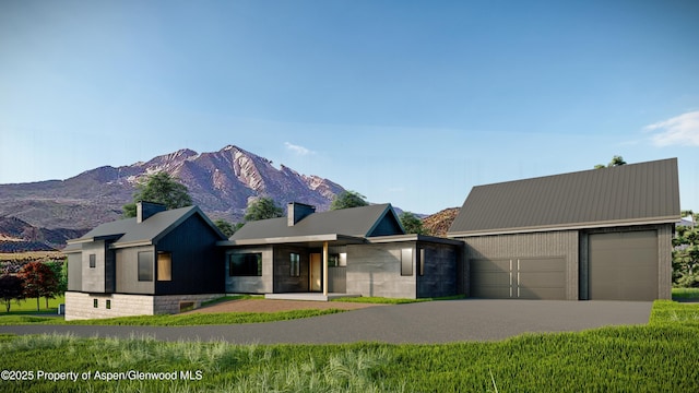 view of front of home featuring a garage and a mountain view