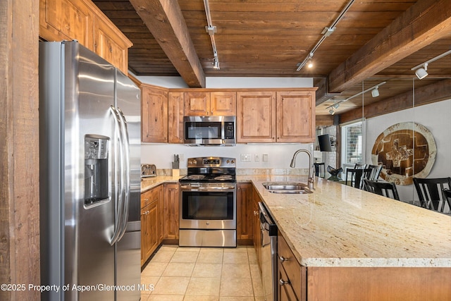 kitchen with beam ceiling, sink, stainless steel appliances, light tile patterned flooring, and wood ceiling