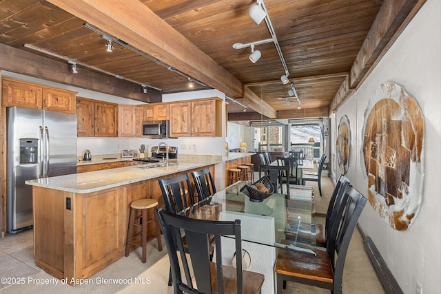 kitchen featuring kitchen peninsula, wooden ceiling, stainless steel appliances, and track lighting