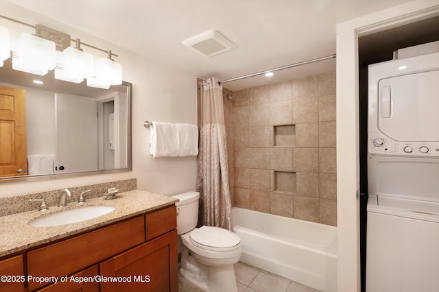 full bathroom featuring shower / bath combination with curtain, tile patterned floors, vanity, toilet, and stacked washer / drying machine