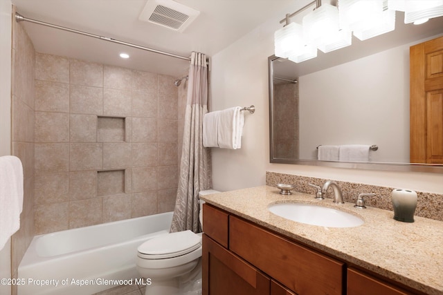 full bathroom featuring shower / tub combo, vanity, and toilet