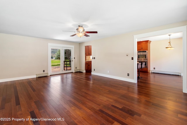 unfurnished living room featuring a baseboard heating unit, baseboards, a ceiling fan, and dark wood-style floors
