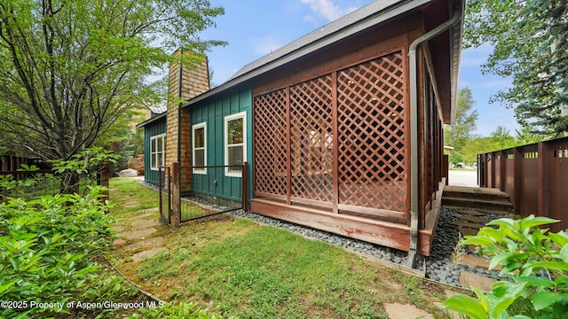 225 Juniper Ct, Basalt, CO 81621 - view of home's exterior featuring a chimney and board and batten siding