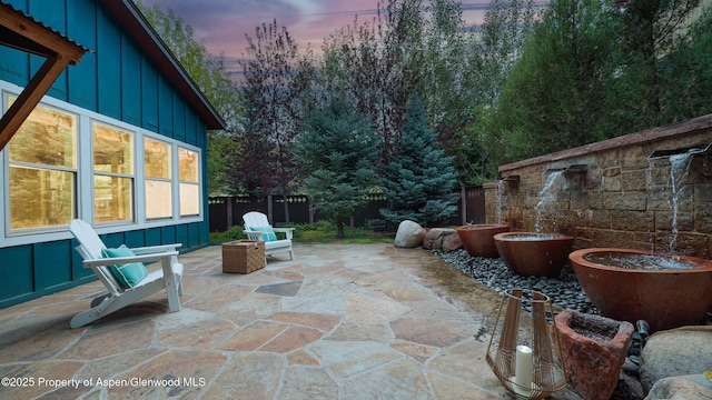 225 Juniper Ct, Basalt, CO 81621 - patio terrace at dusk with a fenced backyard and a patio area