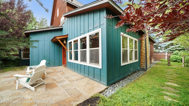 225 Juniper Ct, Basalt, CO 81621 - view of side of home with board and batten siding and a patio area