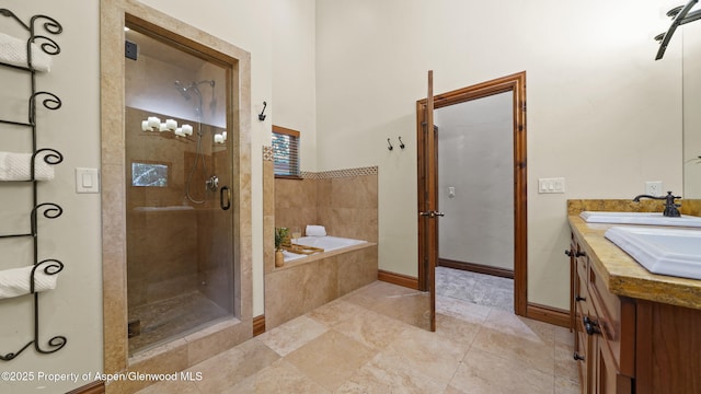 225 Juniper Ct, Basalt, CO 81621 - bathroom with a bath, a stall shower, double vanity, and tile patterned floors