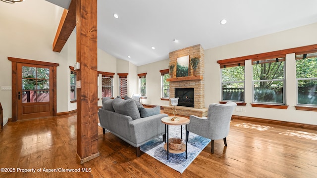 225 Juniper Ct, Basalt, CO 81621 - living room with hardwood / wood-style floors, a fireplace, plenty of natural light, recessed lighting, and high vaulted ceiling