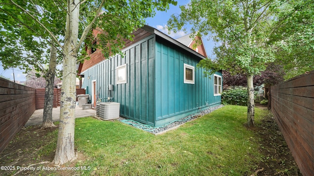 225 Juniper Ct, Basalt, CO 81621 - view of side of home with board and batten siding, a fenced backyard, and a patio area