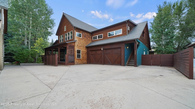 225 Juniper Ct, Basalt, CO 81621 - view of front of house with a garage, concrete driveway, and a shingled roof