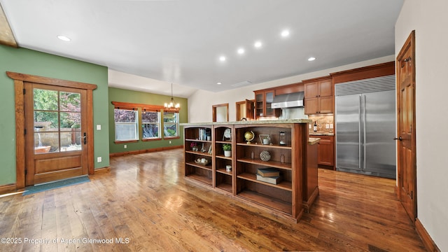 225 Juniper Ct, Basalt, CO 81621 - kitchen featuring stainless steel built in refrigerator, open shelves, a chandelier, wall chimney range hood, and recessed lighting