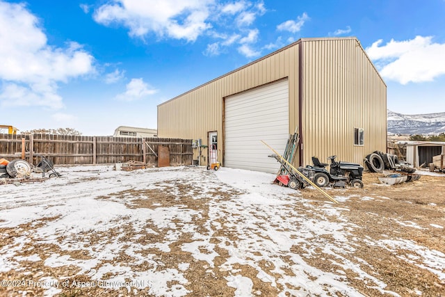 view of snow covered garage