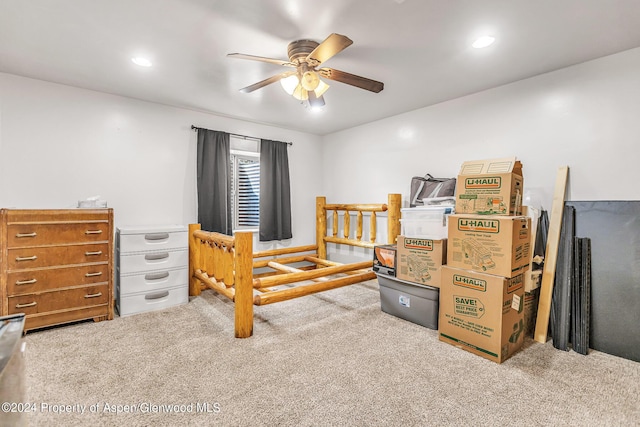 carpeted bedroom featuring ceiling fan