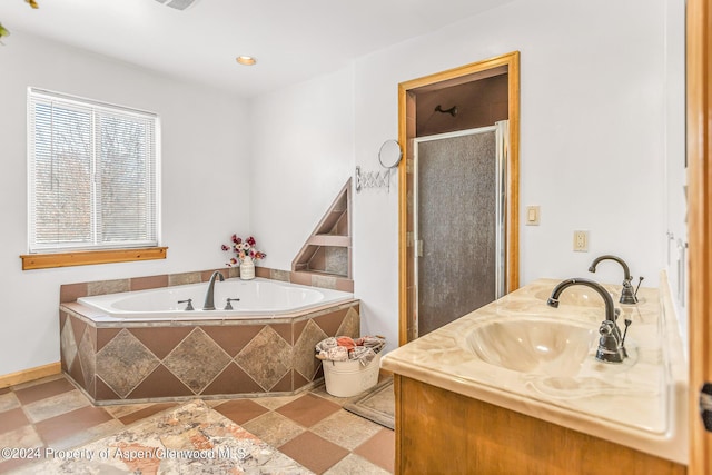 bathroom with vanity and separate shower and tub