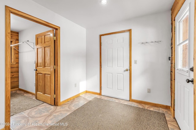 foyer entrance featuring light tile patterned floors