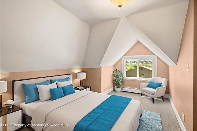 440 Whiteriver Ave, Rifle, CO 81650 - carpeted bedroom featuring a baseboard heating unit and lofted ceiling