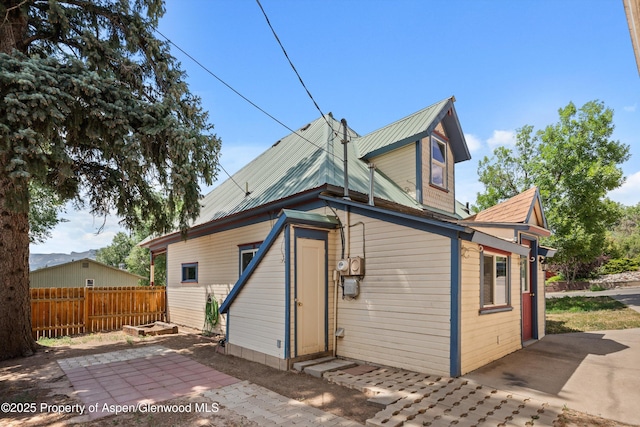 440 Whiteriver Ave, Rifle, CO 81650 - rear view of property featuring a patio and a metal roof