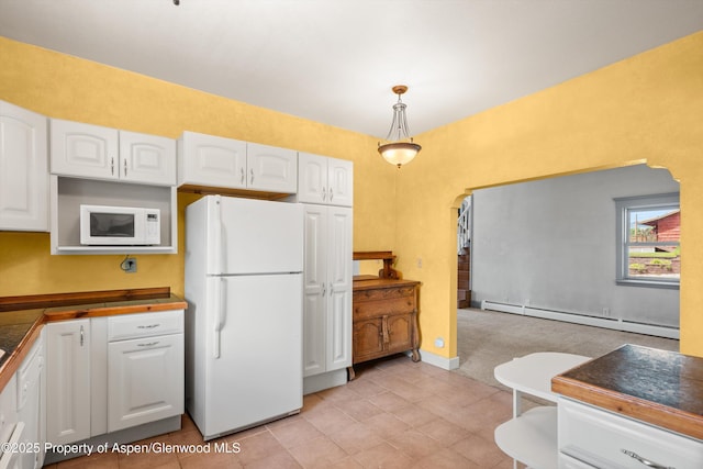 440 Whiteriver Ave, Rifle, CO 81650 - kitchen featuring white appliances, baseboard heating, white cabinets, arched walkways, and pendant lighting