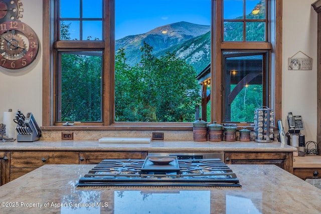 606 Dorais Way, Redstone, CO 81623 - kitchen view of mountains, stovetop, and light stone countertops