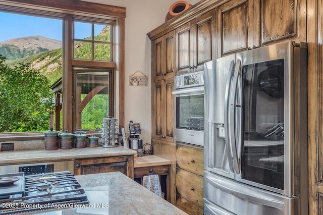 606 Dorais Way, Redstone, CO 81623 - kitchen featuring stainless steel appliances, a mountain view, and light countertops