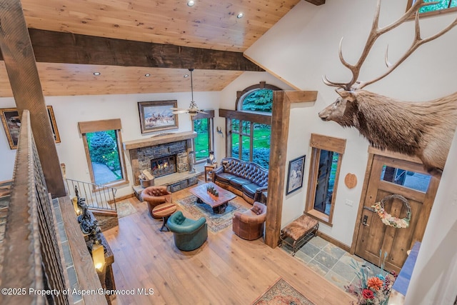 606 Dorais Way, Redstone, CO 81623 - living area with ceiling fan, recessed lighting, a stone fireplace, wood finished floors, and wood ceiling