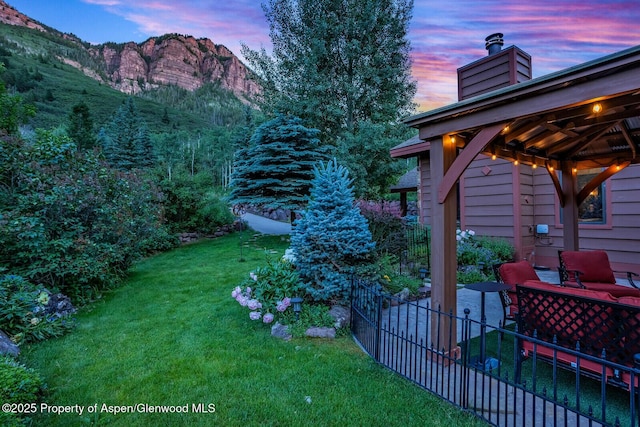 606 Dorais Way, Redstone, CO 81623 - yard at dusk with a yard, a mountain view, a gazebo, and a patio