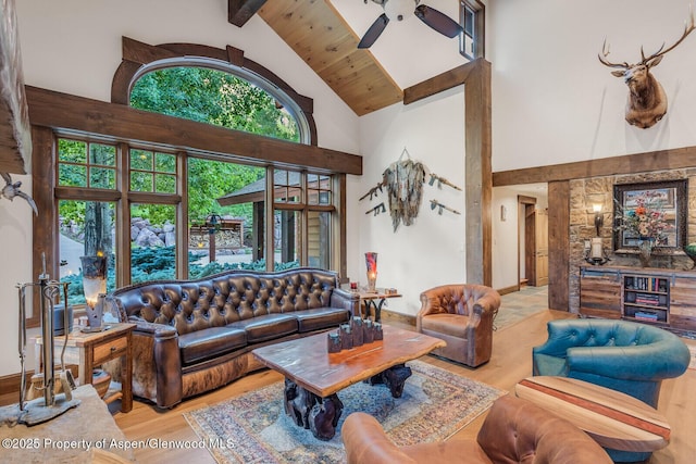 606 Dorais Way, Redstone, CO 81623 - living area featuring high vaulted ceiling, beam ceiling, and wood finished floors