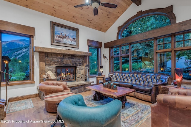 606 Dorais Way, Redstone, CO 81623 - living area with wood finished floors, a fireplace, a wooden ceiling with exposed beams, a ceiling fan, and high vaulted ceiling