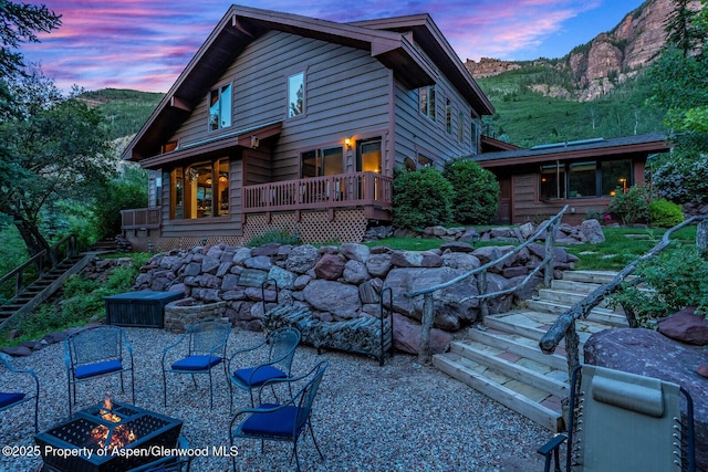 606 Dorais Way, Redstone, CO 81623 - back of property featuring stairway, a fire pit, and a mountain view