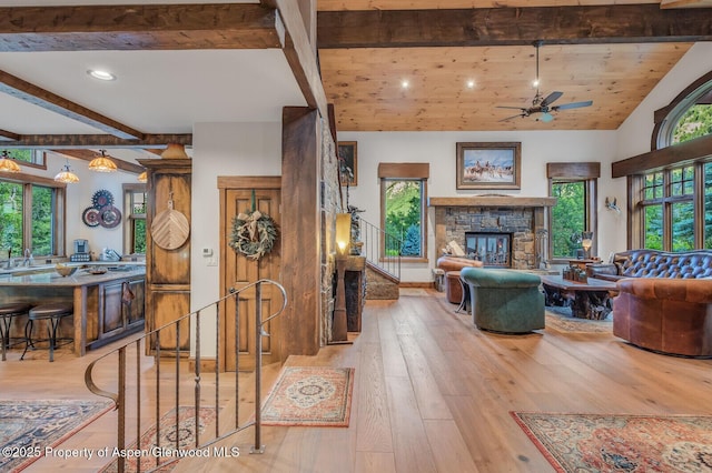 606 Dorais Way, Redstone, CO 81623 - living room with beam ceiling, ceiling fan, a fireplace, hardwood / wood-style floors, and recessed lighting
