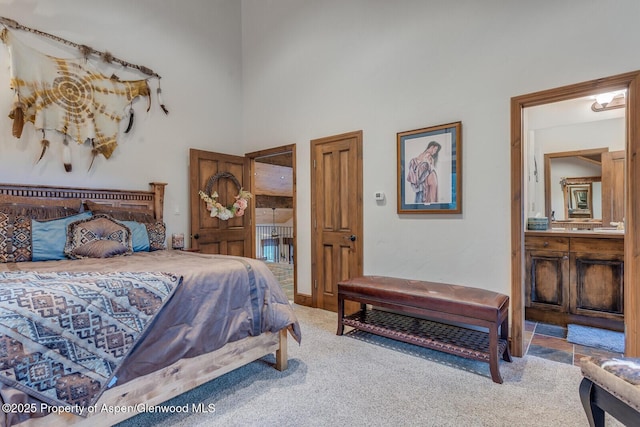 606 Dorais Way, Redstone, CO 81623 - carpeted bedroom with a high ceiling and ensuite bath